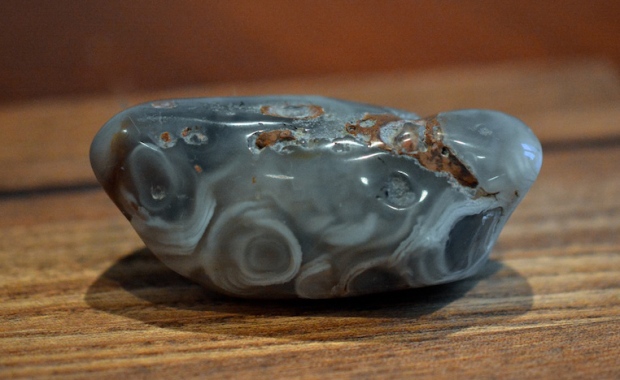 A blue-gray polished agate with circular swirls.  You can't see it, but there is water inside.